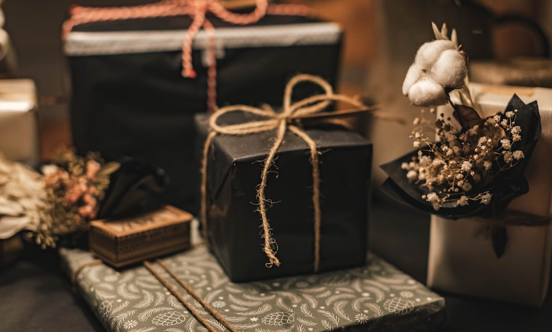 black and brown gift box on white and black floral textile
