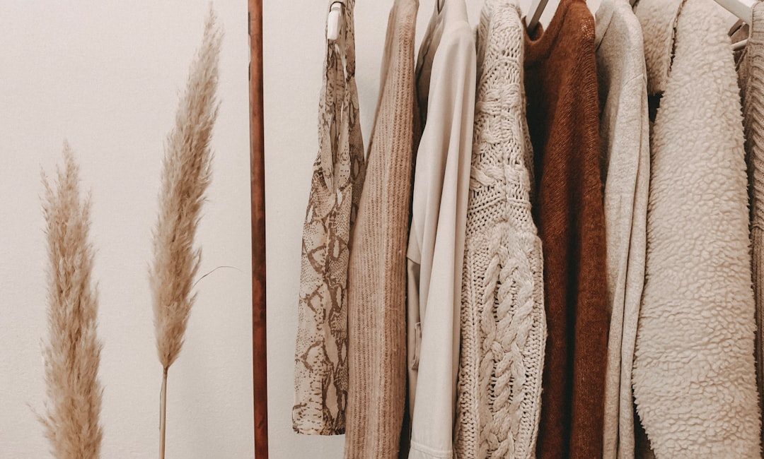 hanged top on brown and white clothes horse