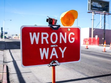 red Wrong Way signage on road