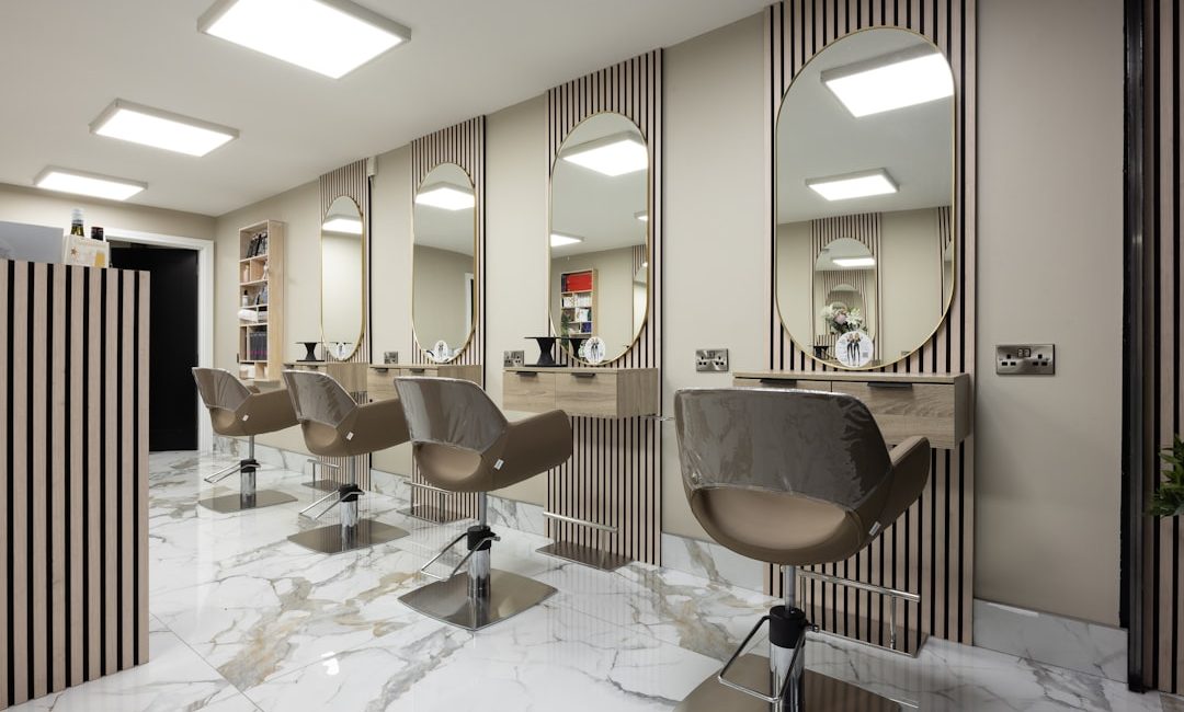 a hair salon with chairs and mirrors